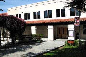 Two-story building labeled 'Music and Dance Facility 2.0' with adjacent trees.