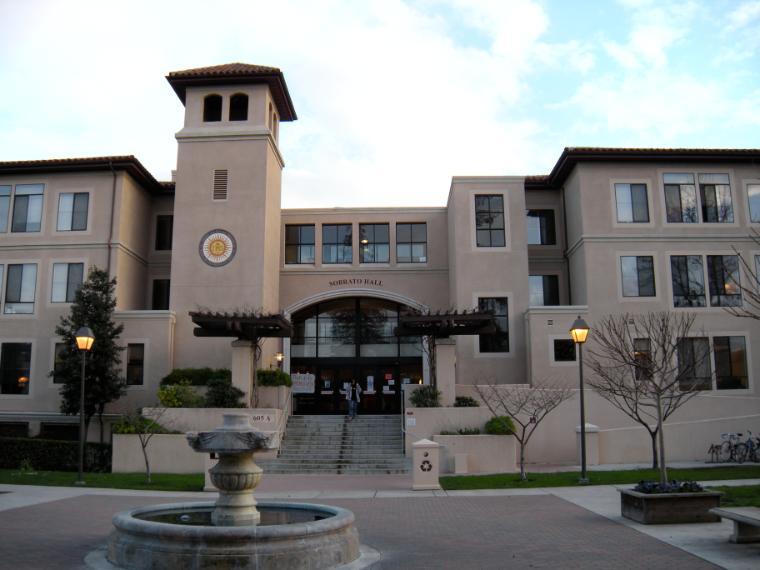 Sobrato Residence Hall building with staircase and fountain in front.