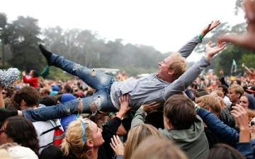 A Passion Pit fan crowd surfs at Outside Lands in Golden Gate Park on Saturday Aug. 11, 2012 in San Francisco. image link to story