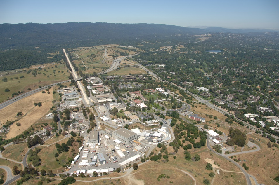 Caption: The two-mile long SLAC linear accelerator. Running left and right is Highway 280, and from the right side up toward the top is Sand Hill Road. The Santa Cruz mountains are in the background.