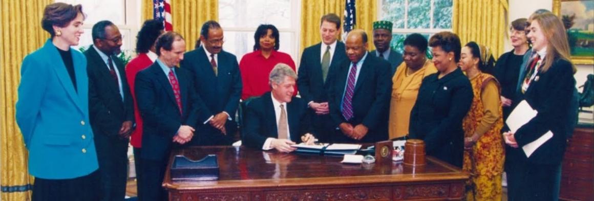 Photo of President Bill Clinton signing Executive Order inspired by activist Hazel M. Johnson.