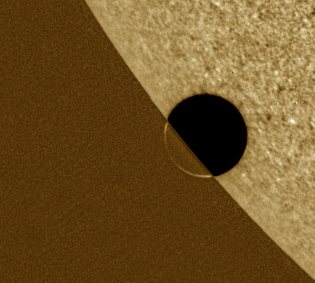 Venus as it begins a transit across the face of the Sun