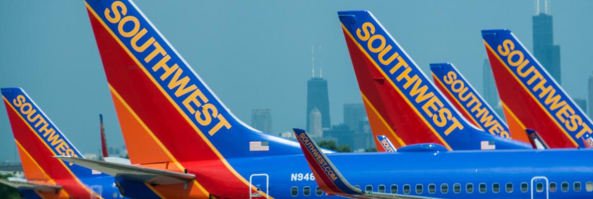 Photo of Southwest Airlines planes lined up on a tarmac.