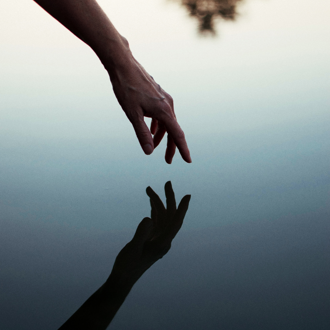 Reflection of a hand in the water 