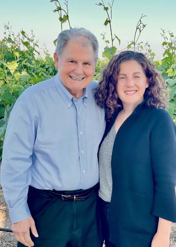 Lisa H. Franzia '96 with her father, Joseph S. Franzia '64, MBA '65 at a Bronco Wine Company vineyard. Photo courtesy of the Franzia family.