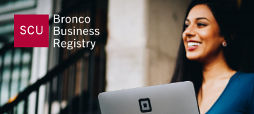 Woman holding computer with Bronco Business Registry Logo