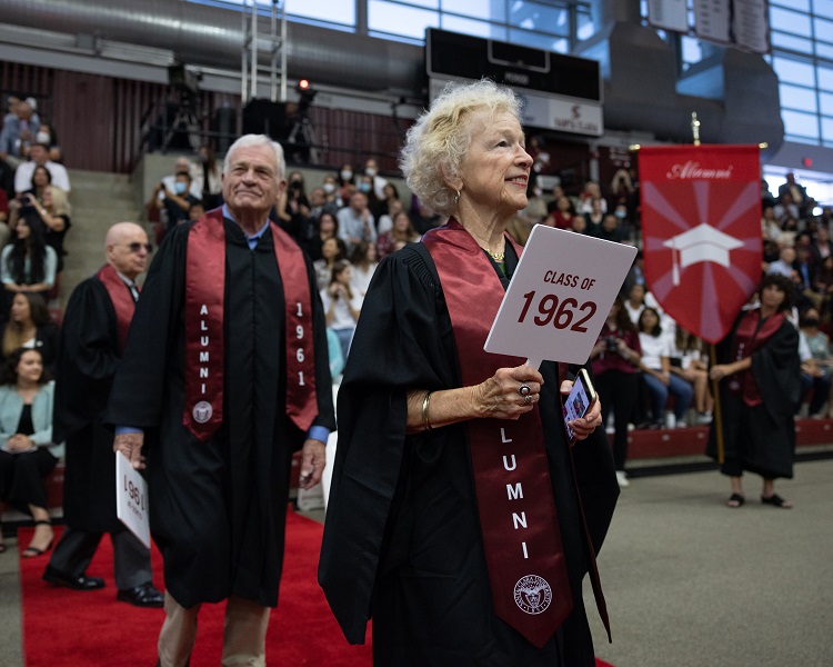 Alumni from the class of 1962 line up in regalia 