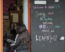Chalk board outside a classroom.