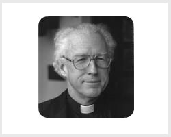 Black and white portrait of Fr. Smith. 