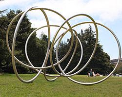 Large metal sculpture with interlocking rings.