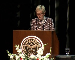 President Julie Sullivan standing at a podium