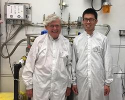 Prof. Allen Sweet standing next to graduate student Szu-Fan (Paul) Wang in the lab.