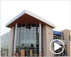 Video still of exterior of the Athletic Excellence Center.