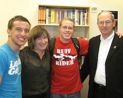 From left, RRC co-founder Kyle Arrouzet ’13, Vice Provost for Student Life & Dean of Students Jeanne Rosenberger, RRC co-founder Devin Wakefield ’13 and then-President Michael Engh, S.J., during the grand opening of the Rainbow Resource Center in 2011.