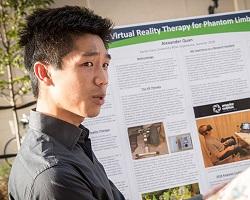 Student Alex Quan presenting his work on virtual reality therapy.