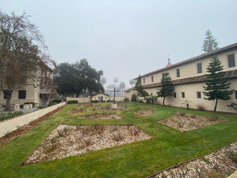 This is the Fifth Mission Cemetery, which was active from 1820-1951 and holds the remains of Indigenous Californians along with Catholics. This cemetery, located adjacent to the Mission, remains unmarked by the University. [Image by Kate Soifer, SCU '22.]