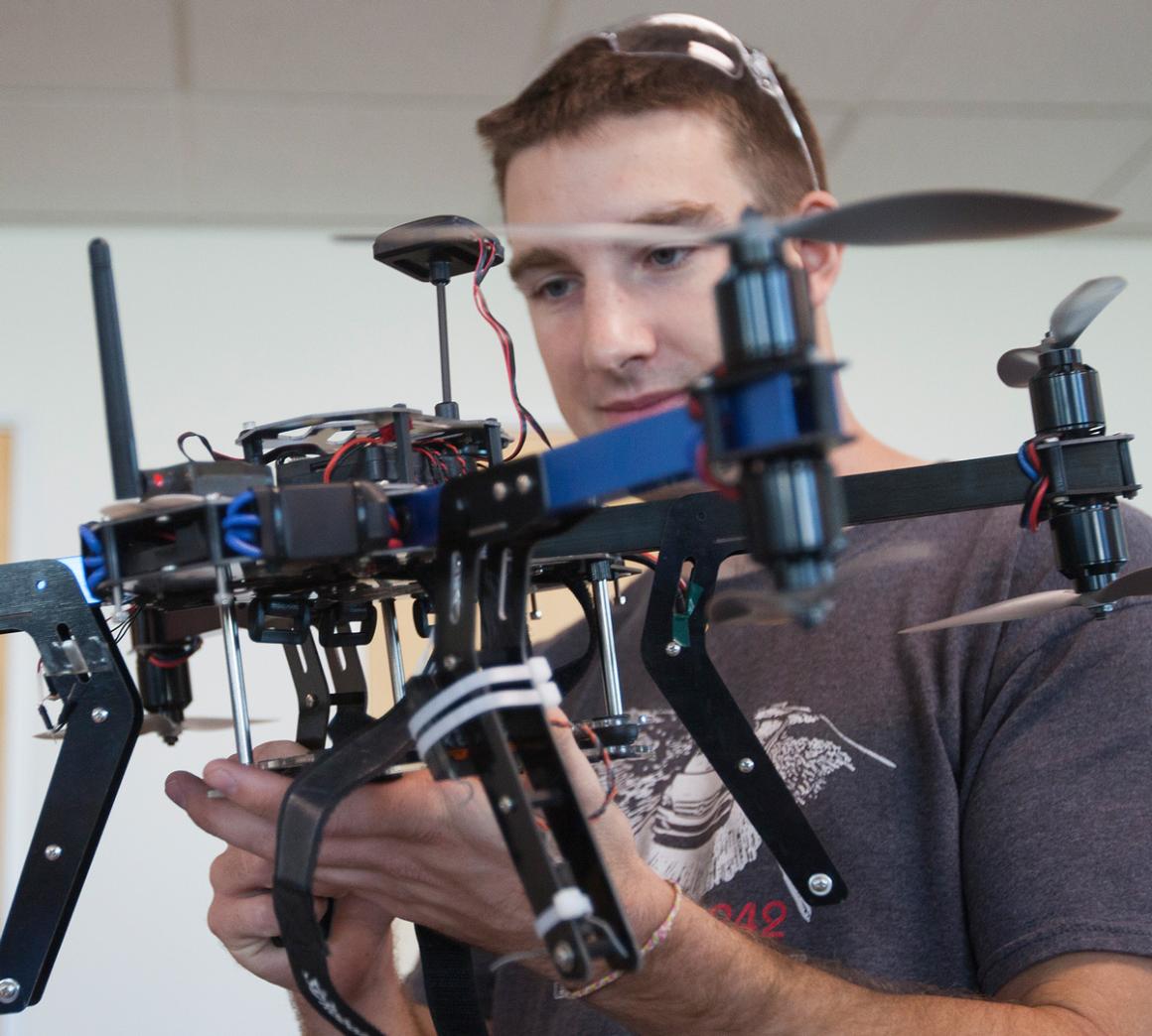A student working on a drone