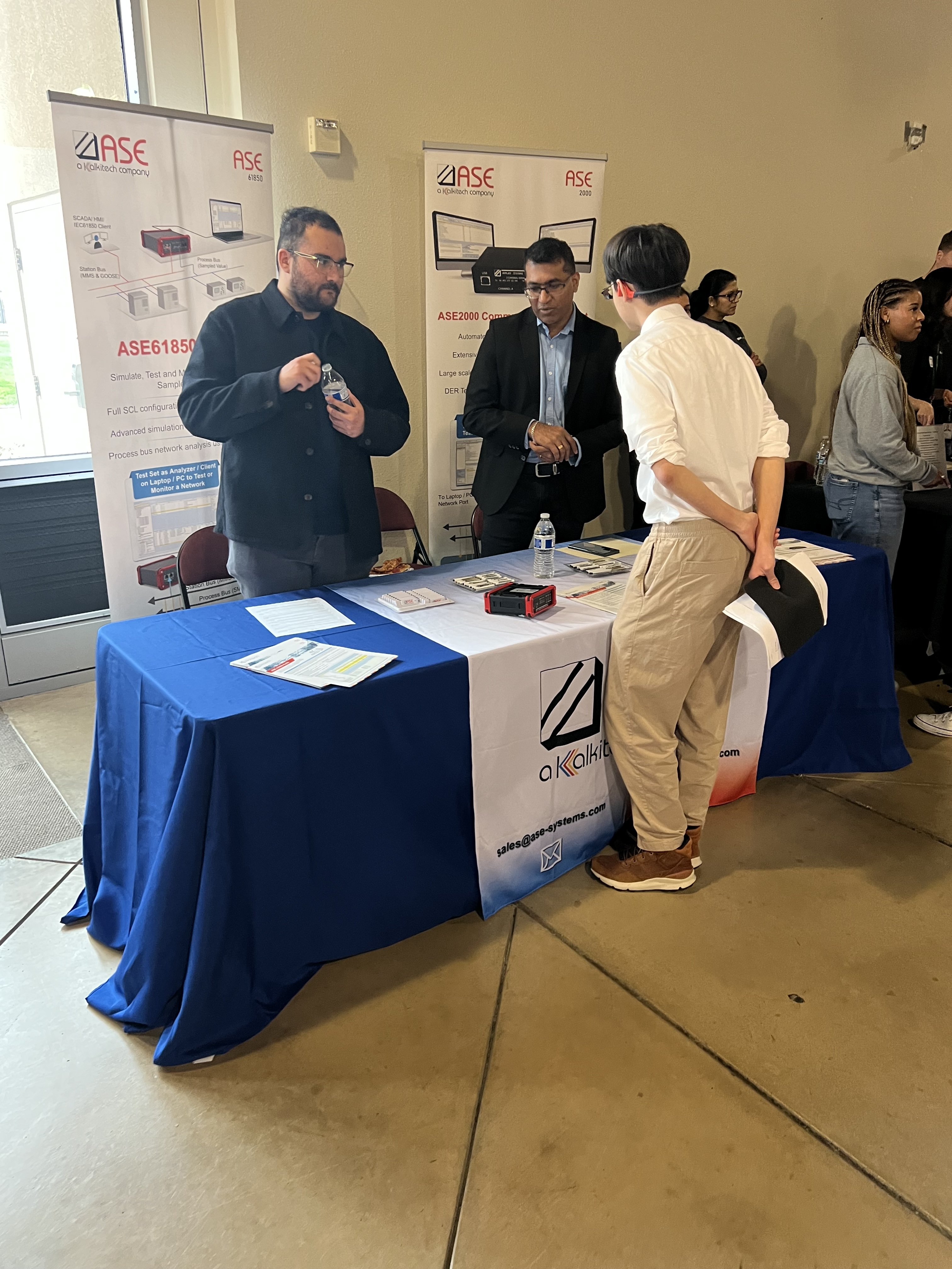 A student speaks with a representative from ASE Group.