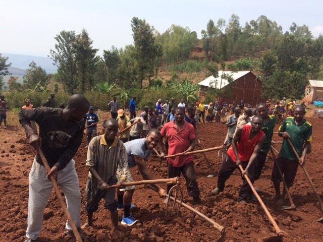 Uche Agwu (MECH '18) and EWB students worked along side at least 200 community members as they worked to level the site for a K-3 elementary school in Rwanda. image link to story