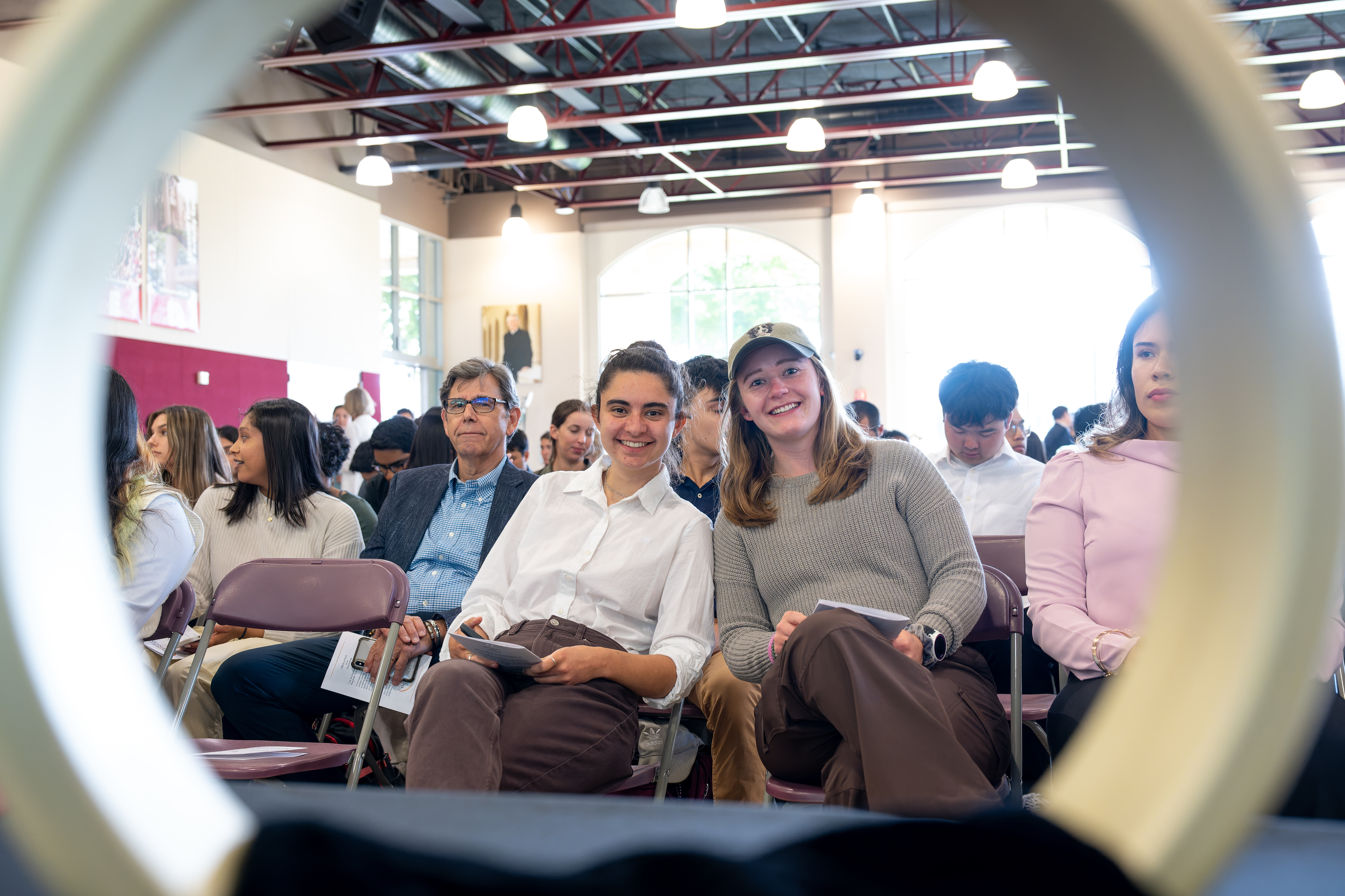 Students participating in the Order of the Engineer ceremony captured through the giant ring 
