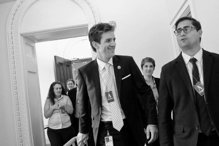Presidential Innovation Fellow Ross Dakin ’07 (left) on the job at the Eisenhower Executive Office Building in Washington, DC