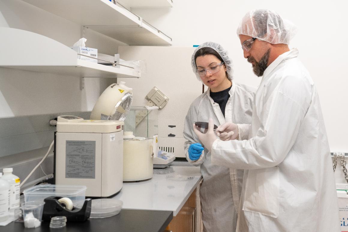 Woman bioengineering graduate student works side-by-side with faculty in the bioengineering lab. image link to story