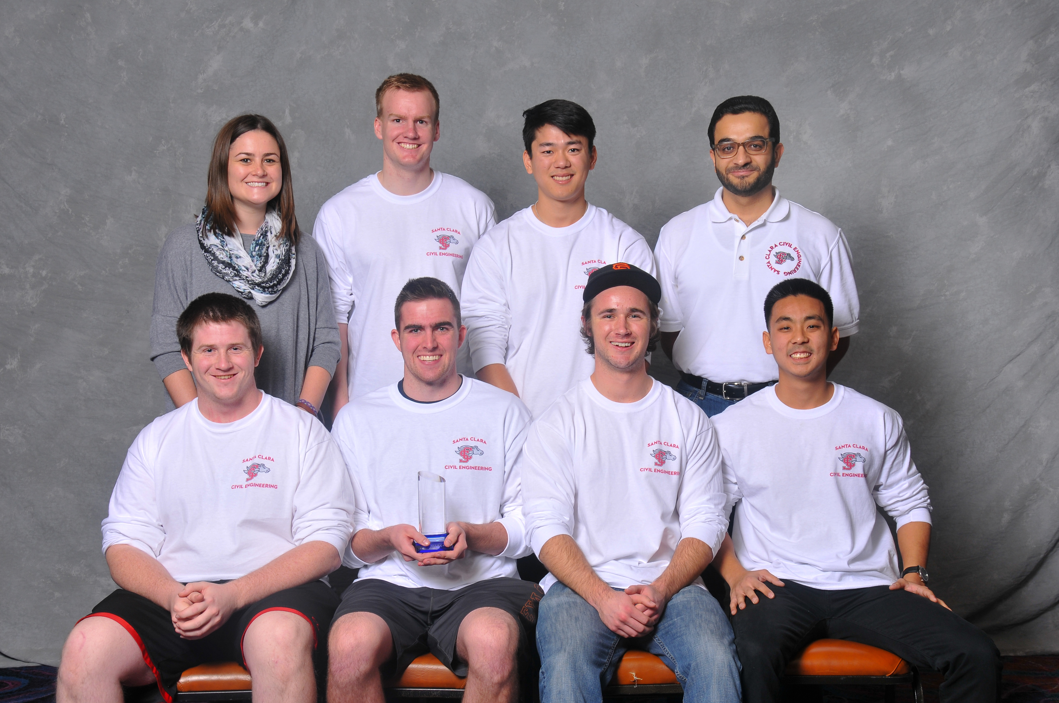 A group photo of 7 students and one faculty holding an glass award for placing third in the 2015 ASC Construction Competition.
