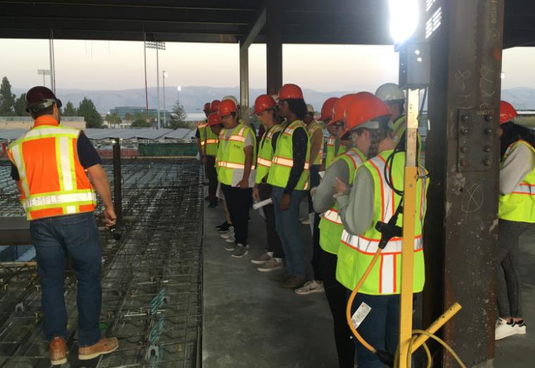 Students with Construction Manager at the SCDI construction site 2019.