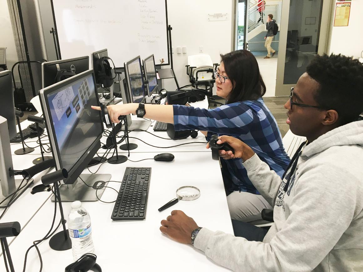 Ellen Tseng and Ken Wakaba work on Sherlock in the Imaginarium. image link to story