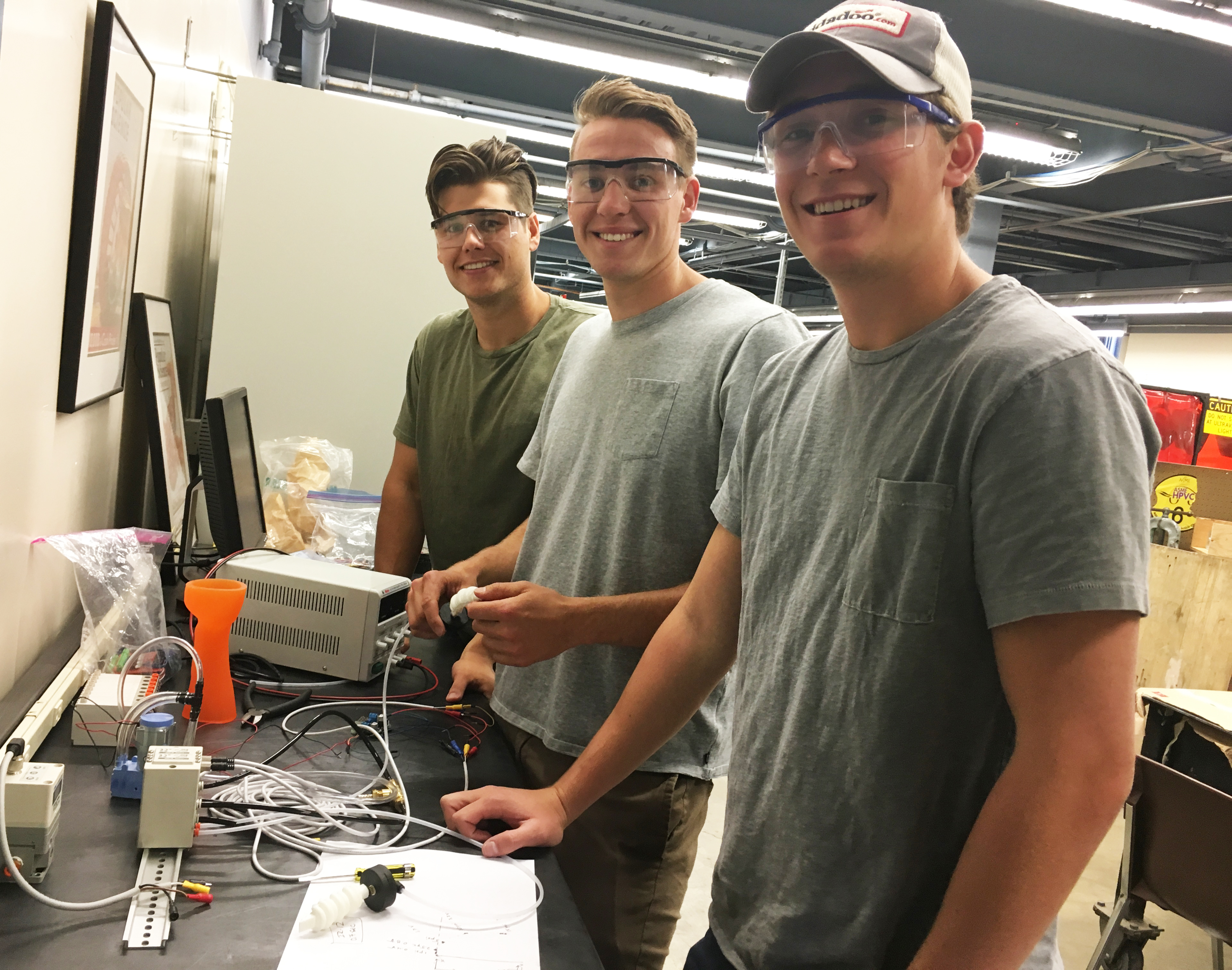David Leonardo, Christopher Szigeti, and Zachary Kisner at work on a soft robotic hand