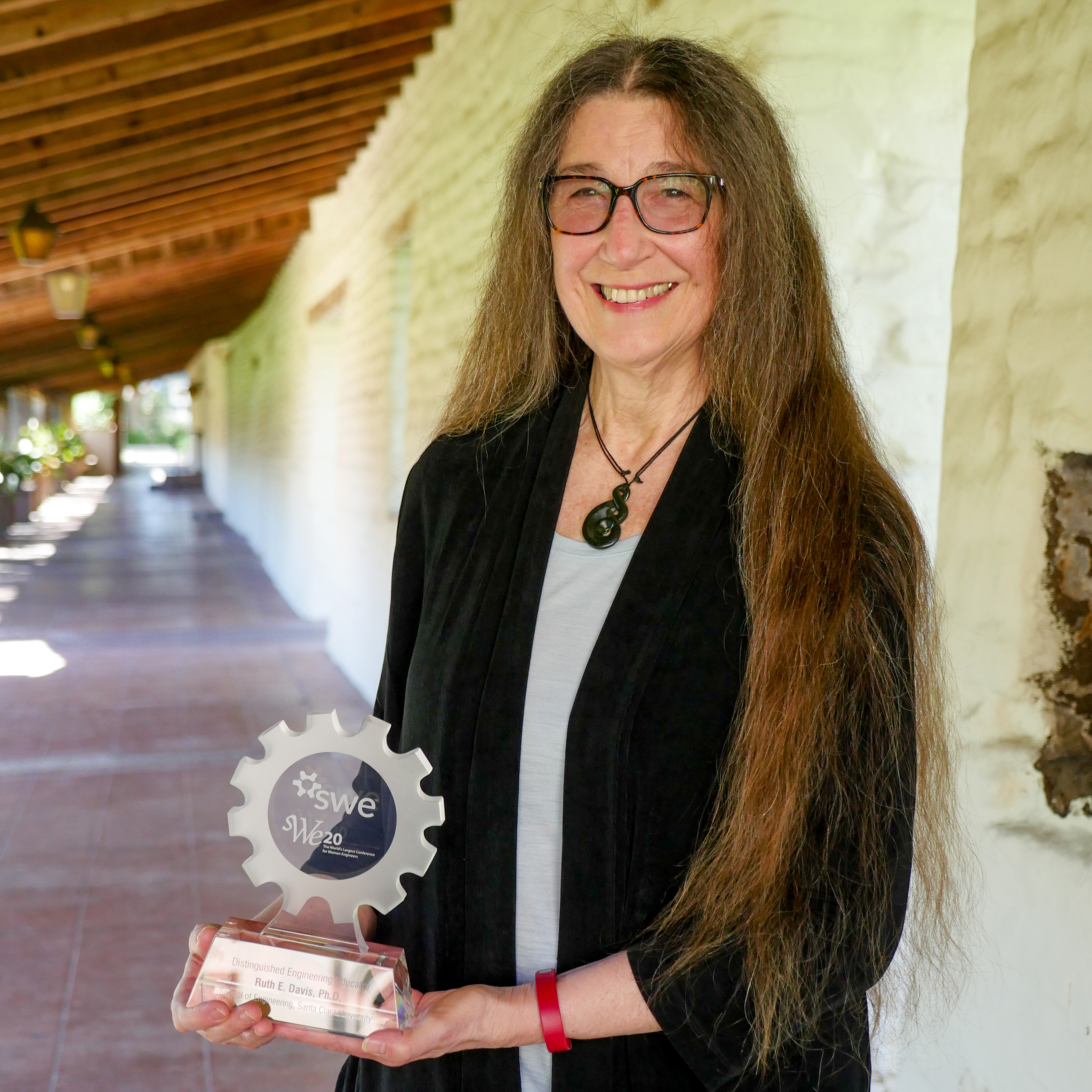Ruth Davis holds her SWE Distinguished Engineering Educator Award image link to story