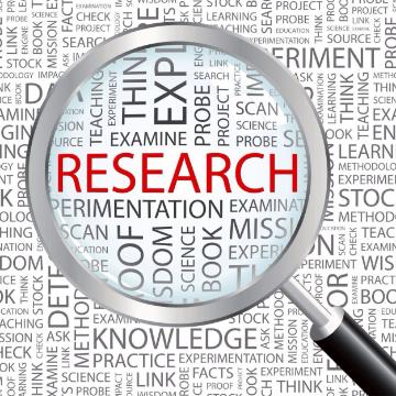 Magnifying glass focusing on the word Research image link to story