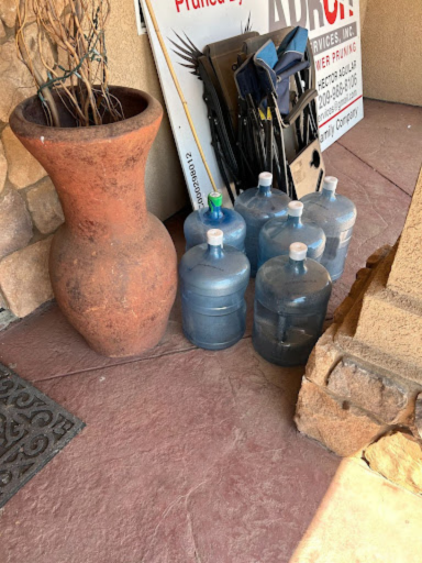 Empty 5-gallon water bottles used to distribute safe water to residents testing above the maximum contaminant levels for nitrates at 10 mg/l. 