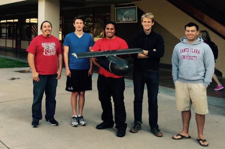 From left, Robert Llanos-Hinson, Thomas Clark, Siosiua Faleta, Micah Klaeser, and Michael Dewane with a portion of their prototype. image link to story