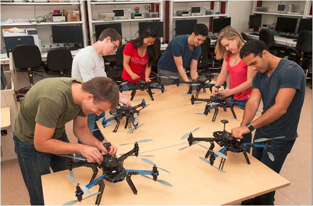Six students working on octocopters in the Robotics Systems Laboratory