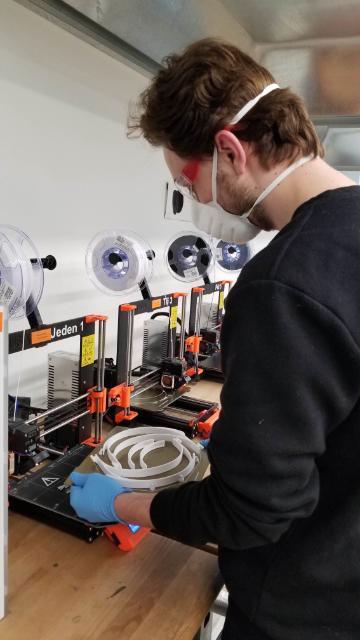 Engineering student makes a medical face shield on a Maker Lab 3D printer image link to story