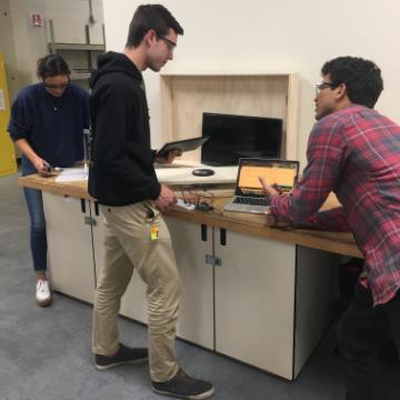 Mechanical engineering seniors Vince Heyman, Timothy Jaworski and Tatianna Schleup creating a standalone device for weighing food waste image link to story