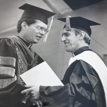 Ignacio Ellacuría on the commencement ceremony stage 