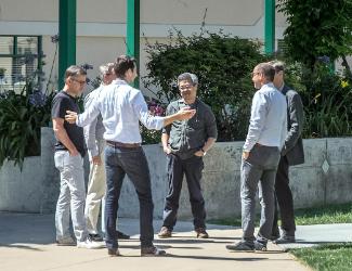 EDC students chatting outside of Lucas Hall.