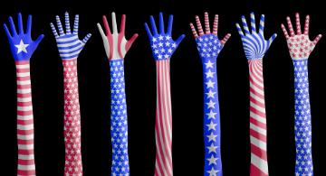 American flag themed hands raised in the air