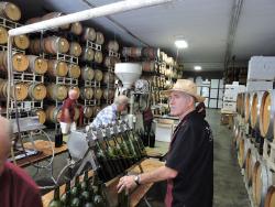 George E. Guglielmo fills wine bottles at Guglielmo Winery's 45th Cork Equity. 