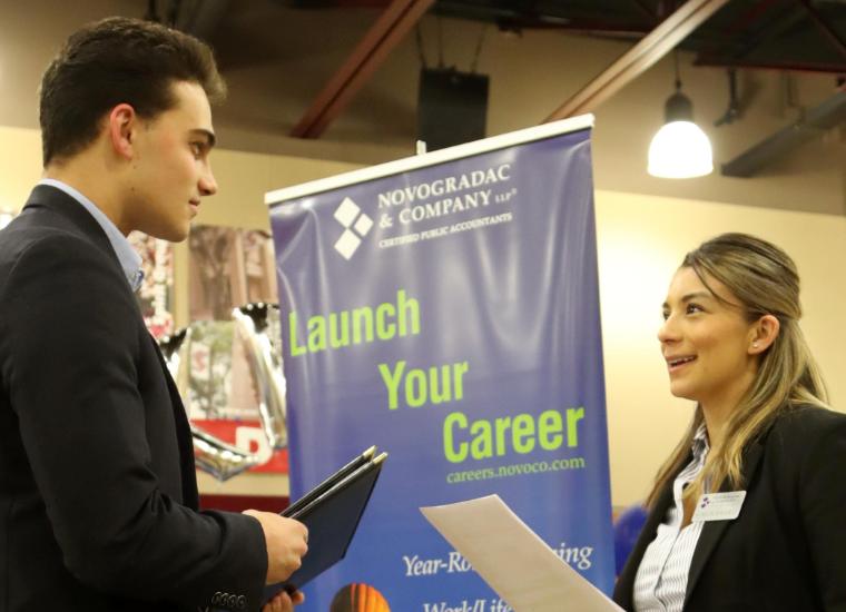 Student and recruiter talking at Sophomore Career Fair image link to story
