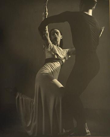 Photograph of Martha Graham dancing with Erik Hawkins in American Document (Puritan Love Duet). Photograph taken by Barbara Morgan.