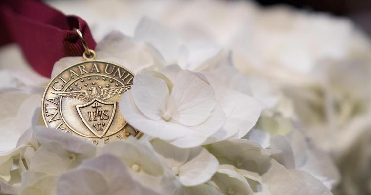 Senior awards medal on bed of flowers. image link to story