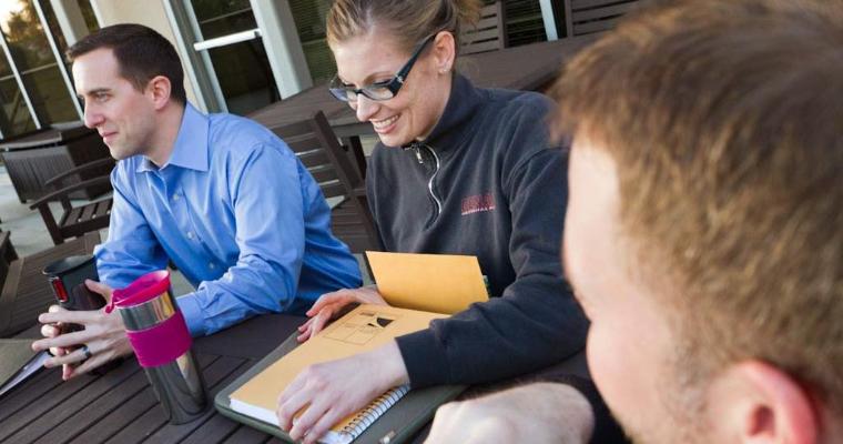 MBA students on balcony