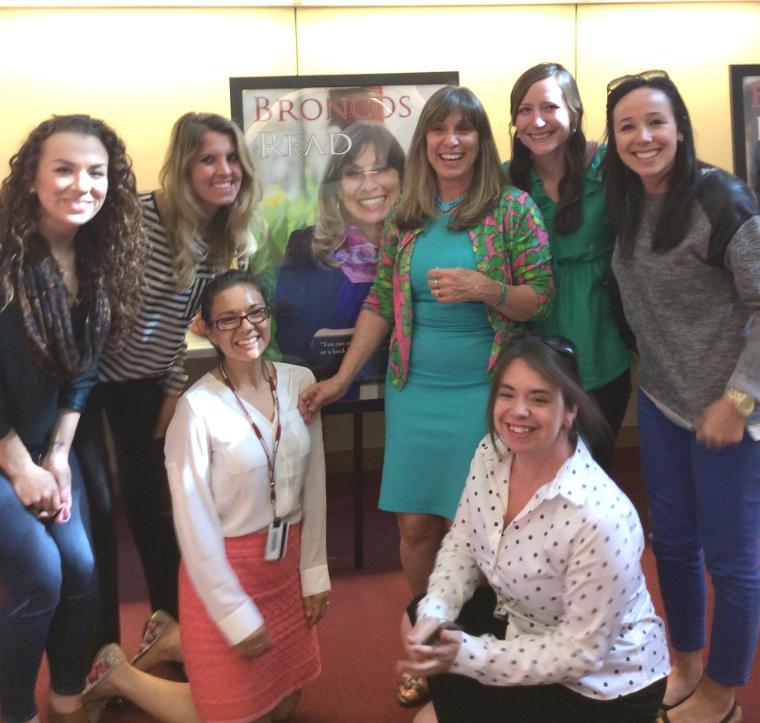 Leslie Leonetti '73 (Class Giving Officer for the Office of Development) celebrates with her colleagues that nominated her for the 2015 Broncos Read Poster.