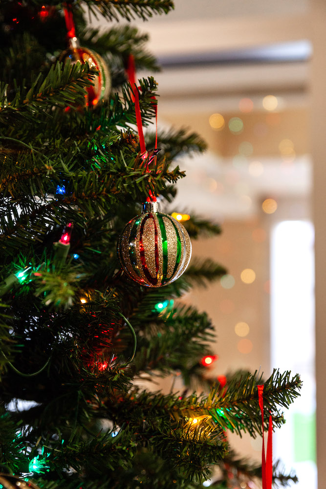 A closeup of ornaments and lights on a Christmas tree